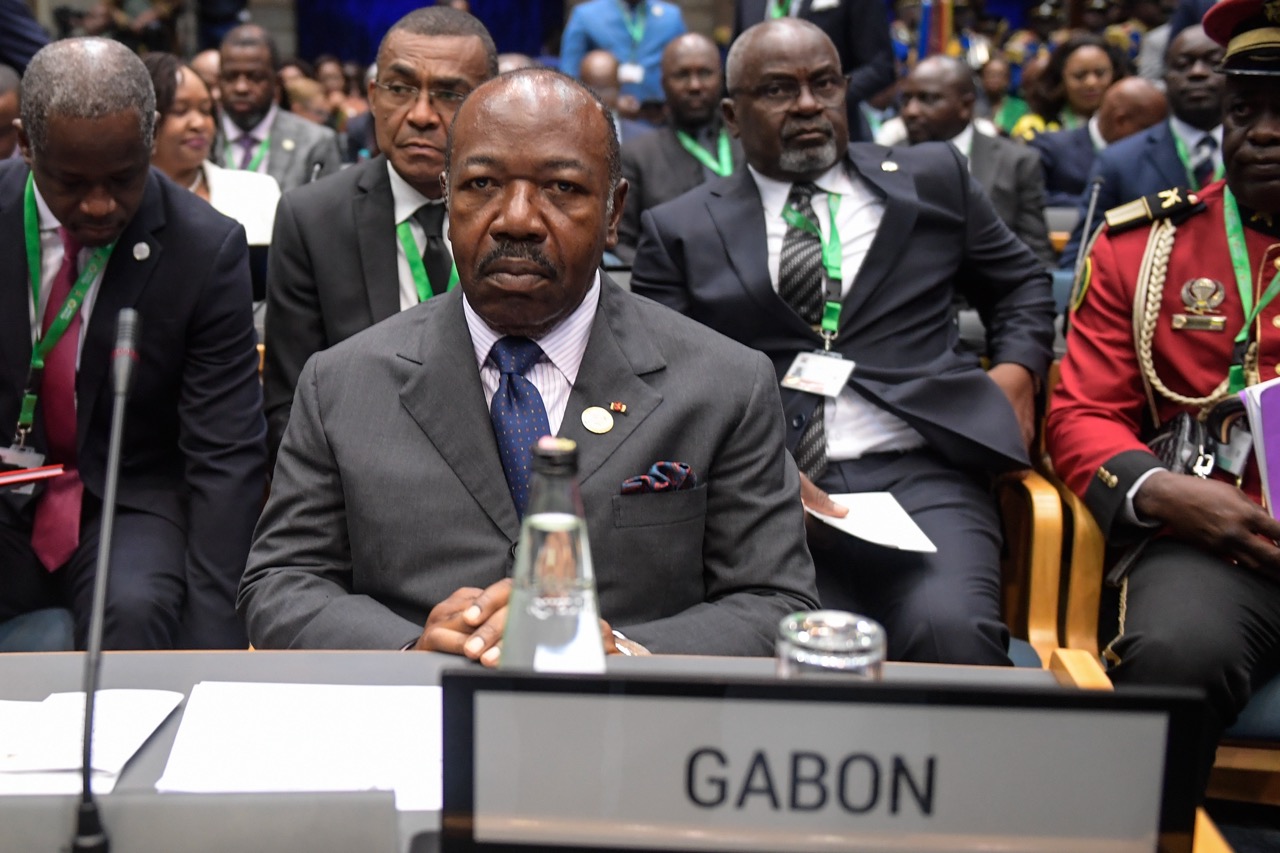 Gabon's President Ali Bongo Ondimba listens during the 5th mid-year coordination meeting of the African Union, at the United Nations (UN) offices in Gigiri, Nairobi, on July 16, 2023. - Twelve Gabonese soldiers appeared on television Wednesday announcing they were cancelling the results of the country's recent election and dissolving "all the institutions of the republic", as AFP journalists heard gunfire in the capital Libreville. (Photo by SIMON MAINA / AFP)