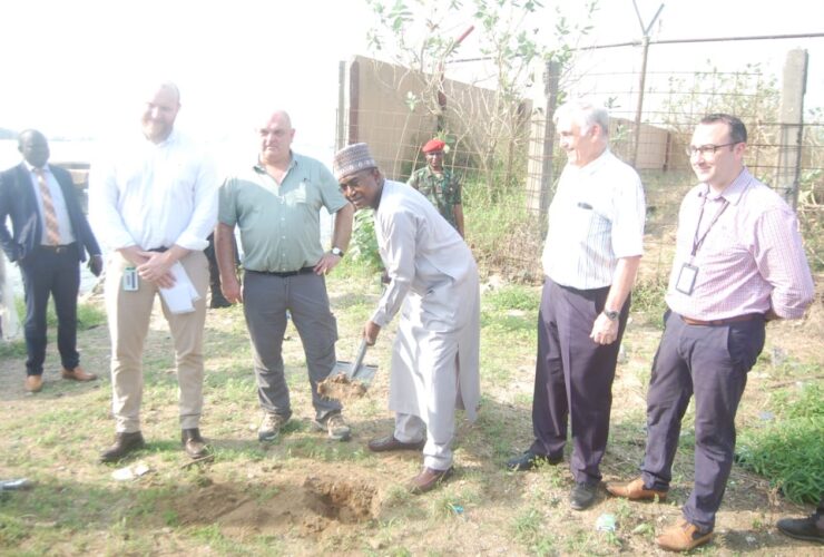 Chairman/Chief Executive Officer of the National Drug Law Enforcement Agency, NDLEA, Brig Gen Mohamed Buba Marwa (Retd) holding a shovel while performing the groundbreaking of the NDLEA Marine Unit headquarters being built by the British Government through the UK Home Office International Operations (HOIO) at the Eko Atlantic City beach, Victoria Island Lagos. He's flanked by HOIO officials and the contractors handling the project.