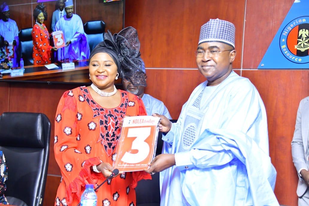 Chairman/Chief Executive Officer of the National Drug Law Enforcement Agency, NDLEA, Brig. Gen. Mohamed Buba Marwa (Retd) presenting a copy of NDLEA Copy to Representative of the First Lady, Senator Oluremi Tinubu, Mrs. Elizabeth Egbetokun, wife of Inspector General of Police at the opening ceremony of a two-day Drug Prevention Treatment and Care, DPTC, training organised by NDLEA for wives of state governors in Abuja on Monday 12th February 2024.