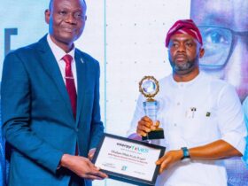 R-L: GCEO NNPC Ltd, Mr. Mele Kyari (represented by the Chief Corporate Communications Officer, NNPC Ltd, Mr. Olufemi Soneye) receives the Energy Times Newspaper's GCEO of the Year Award from Rev. Dr. Wole Adebayo of Foursquare Gospel Church in Nigeria, during the Newspaper's 2024 Awards Ceremony, held at the Eko Hotel & Suites in Lagos, on Friday.