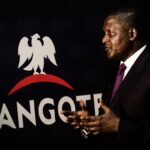 Aliko Dangote, chief executive officer of Dangote Group, gestures after signing a factory construction contract with Sinoma International Engineering Co. Ltd. in Lagos, Nigeria, on Wednesday, Aug. 26, 2015. Dangote Cement has expanded capacity five-fold in the last four years as the company invested outside its home market. Photographer: Tom Saater/Bloomberg