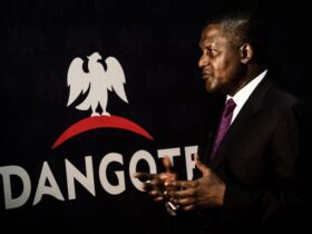 Aliko Dangote, chief executive officer of Dangote Group, gestures after signing a factory construction contract with Sinoma International Engineering Co. Ltd. in Lagos, Nigeria, on Wednesday, Aug. 26, 2015. Dangote Cement has expanded capacity five-fold in the last four years as the company invested outside its home market. Photographer: Tom Saater/Bloomberg