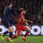 Liverpool's Egyptian forward #11 Mohamed Salah (R) and Paris Saint-Germain's Spanish midfielder #08 Fabian Ruiz (L) fight for the ball during the UEFA Champions League Round of 16 first leg football match between Paris Saint-Germain (FRA) and Liverpool (ENG) at the Parc des Princes stadium in Paris on March 5, 2025. (Photo by FRANCK FIFE / AFP)