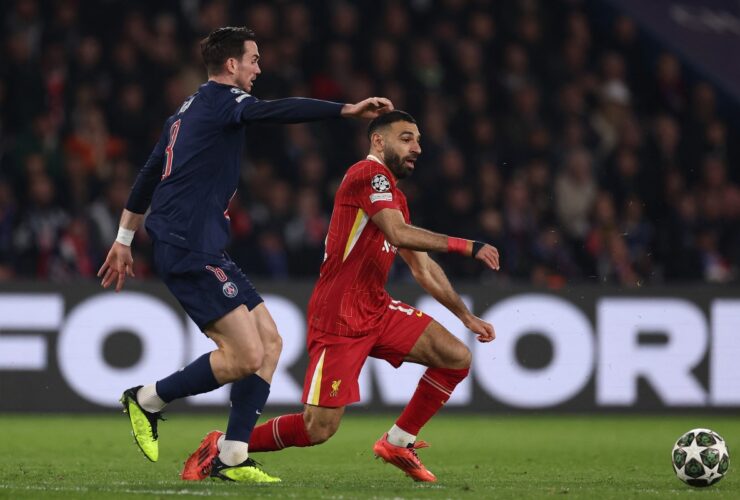 Liverpool's Egyptian forward #11 Mohamed Salah (R) and Paris Saint-Germain's Spanish midfielder #08 Fabian Ruiz (L) fight for the ball during the UEFA Champions League Round of 16 first leg football match between Paris Saint-Germain (FRA) and Liverpool (ENG) at the Parc des Princes stadium in Paris on March 5, 2025. (Photo by FRANCK FIFE / AFP)