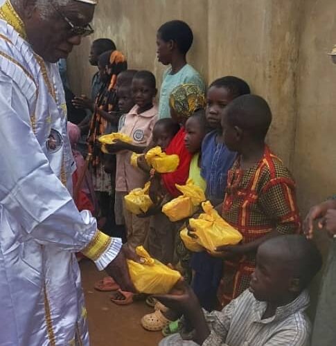 His Most Eminence, Baba-Aladura Bob-Manuel distributing food,money and water.