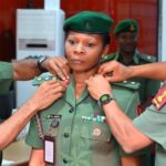 Colonel Anele being decorated by representative COAS.