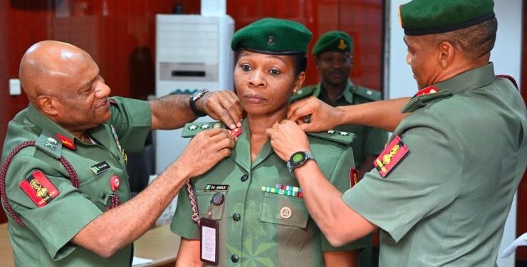 Colonel Anele being decorated by representative COAS.